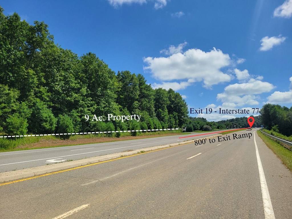 Road-level view along the interstate approach with 